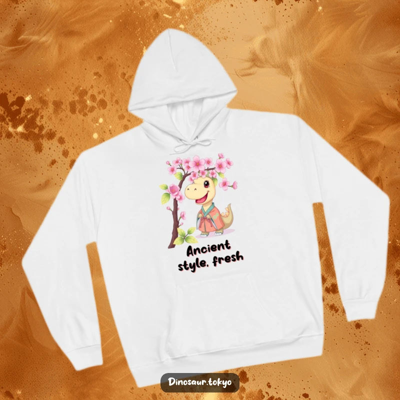 Funny hoodie showcasing a smiling dinosaur in a kimono, peeking from behind a cherry blossom branch, offering warmth and a humorous, cute vibe.
