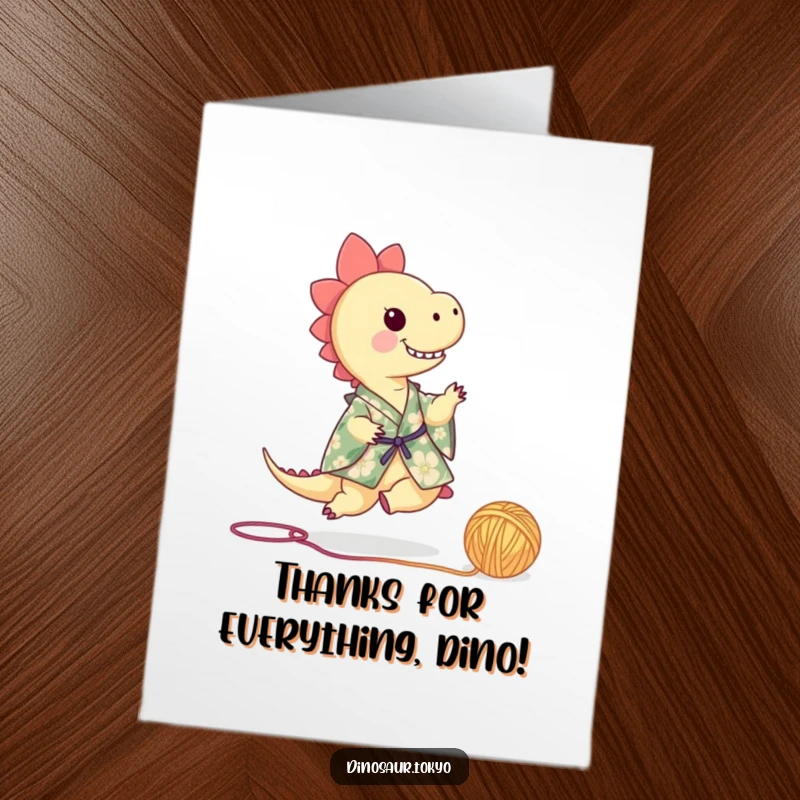 Funny Free Printable Thank You Card: Tiny dinosaur in floral kimono playfully kicking yarn, a unique way to say thanks.