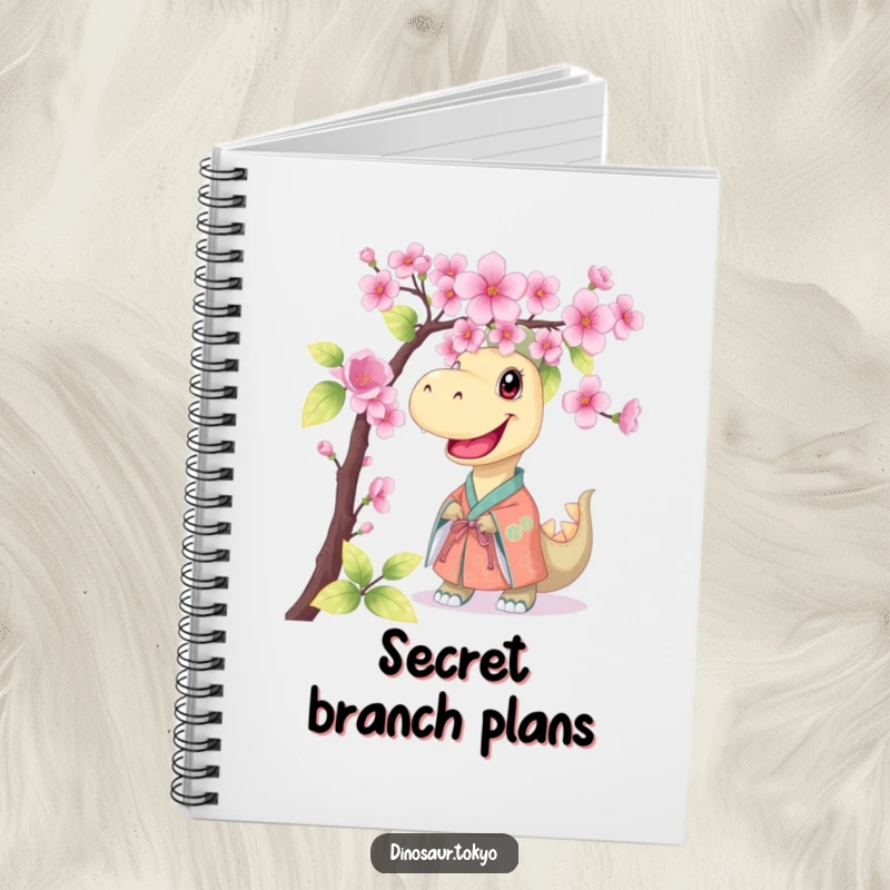 Funny notebook with a smiling dinosaur in a kimono peeking from behind cherry blossoms, perfect for jotting notes with a humorous touch.