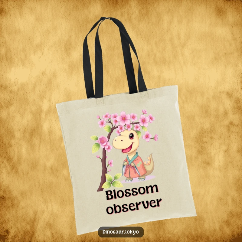Funny tote bag featuring a smiling dinosaur in a kimono, peeking from behind cherry blossoms, ideal for carrying items with a humorous touch.